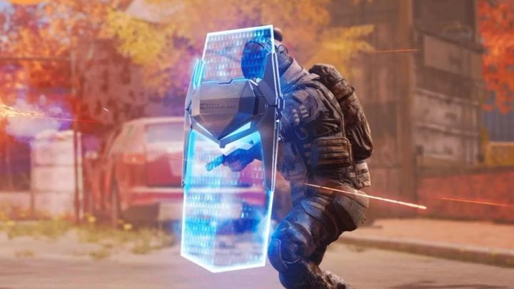 a soldier is holding a futuristic shield in a video game .