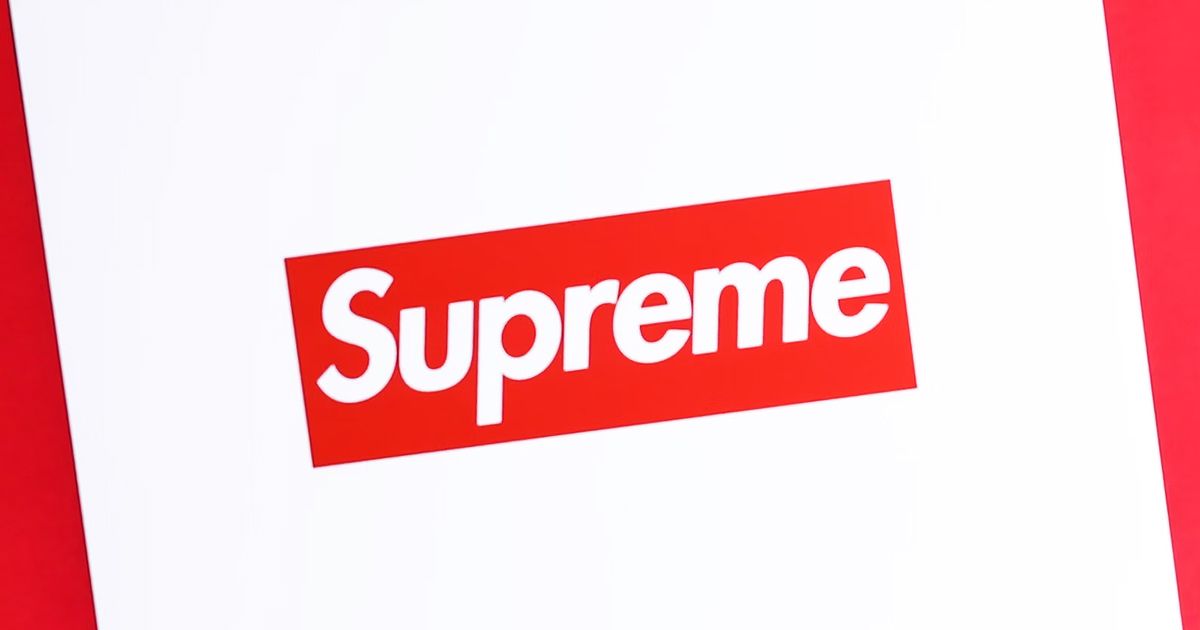 A close-up shot of a white bag with the red Supreme box logo in the center.