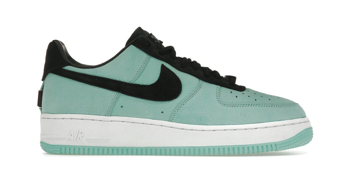 A light blue Air Force 1 Low featuring a black Swoosh down the side to match the laces and heel, plus a white midsole.