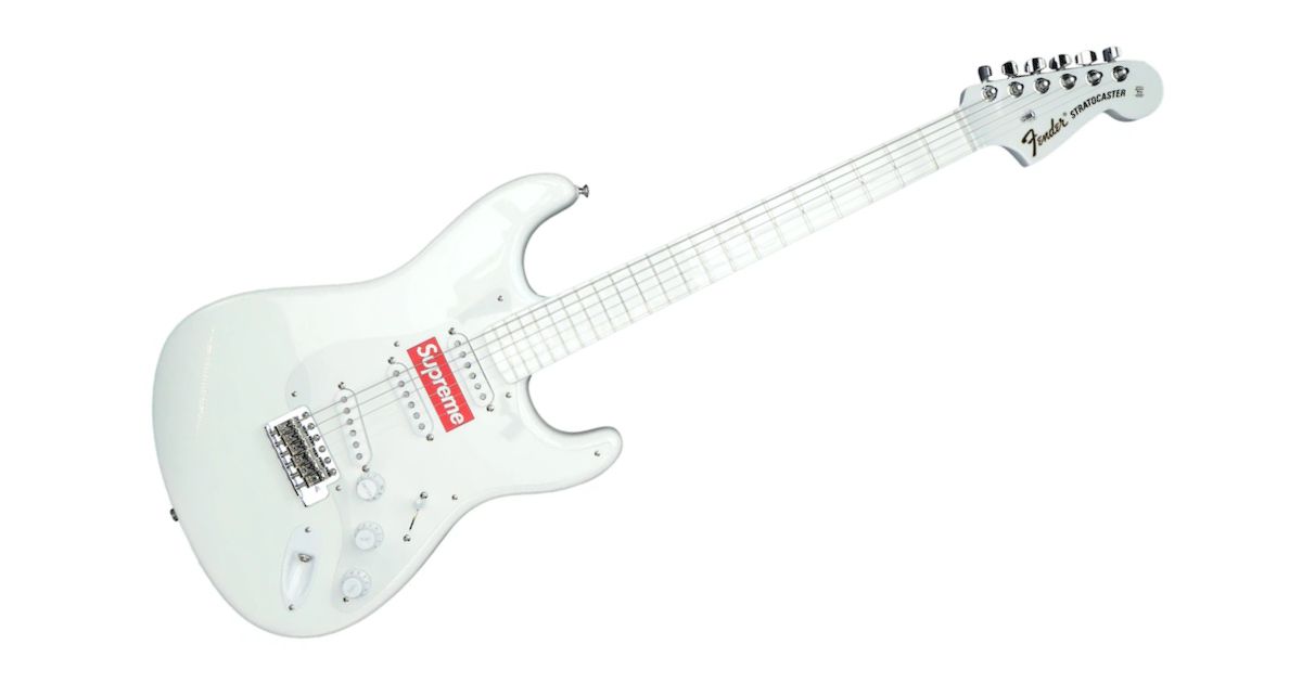 A white Stratocaster guitar with the red Supreme box logo in the center.