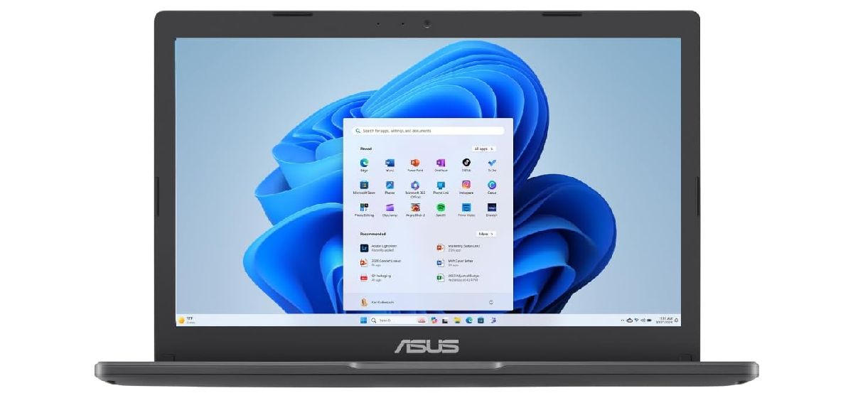 ASUS Vivobook Go product image of a black and dark gray laptop with Windows 11 on the display.