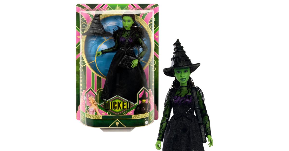 Wicked Singing Elphaba Fashion Doll in a black witches outfit next to its box.