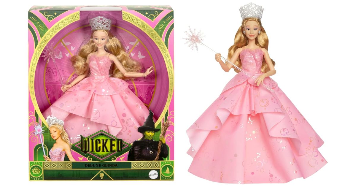 Wicked Deluxe Glinda Doll in a pink dress next to its Wicked-branded box.