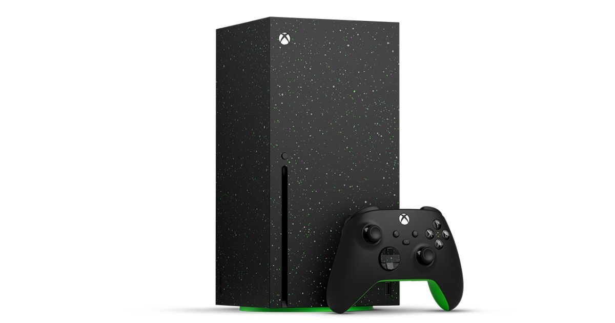 A black Xbox Series X with green speckles all over it and a black and green controller just next to it.