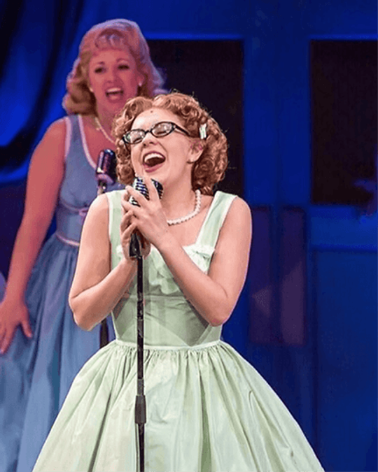 Morgan Kirner performing a solo on stage
