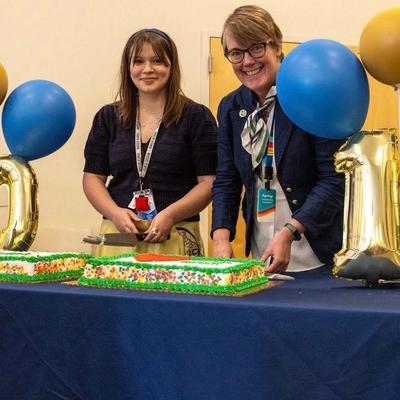 Cutting the cake. Directors (L to R) K. Tate and L. Winterrowd