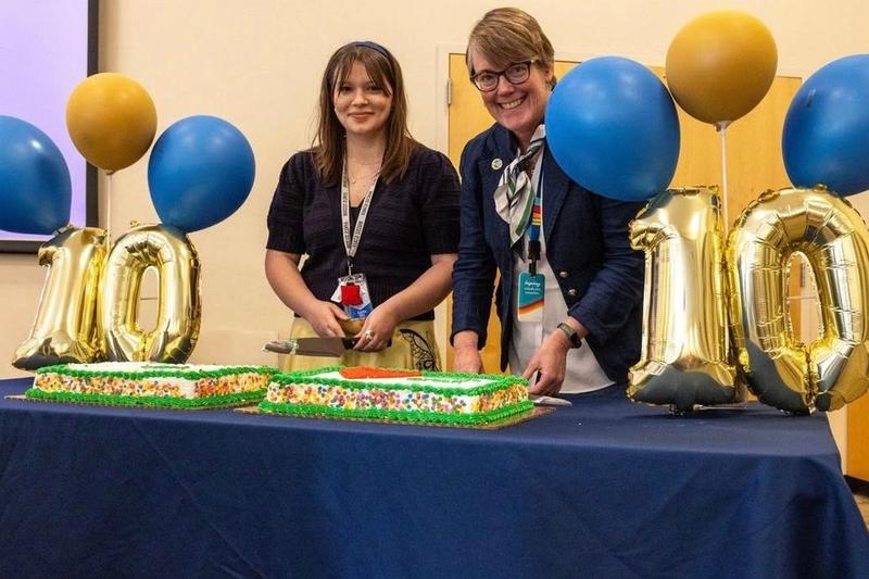 Cutting the cake. Directors (L to R) K. Tate and L. Winterrowd
