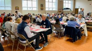 Guests enjoy dinner at St. James' Cathedral Kitchen.