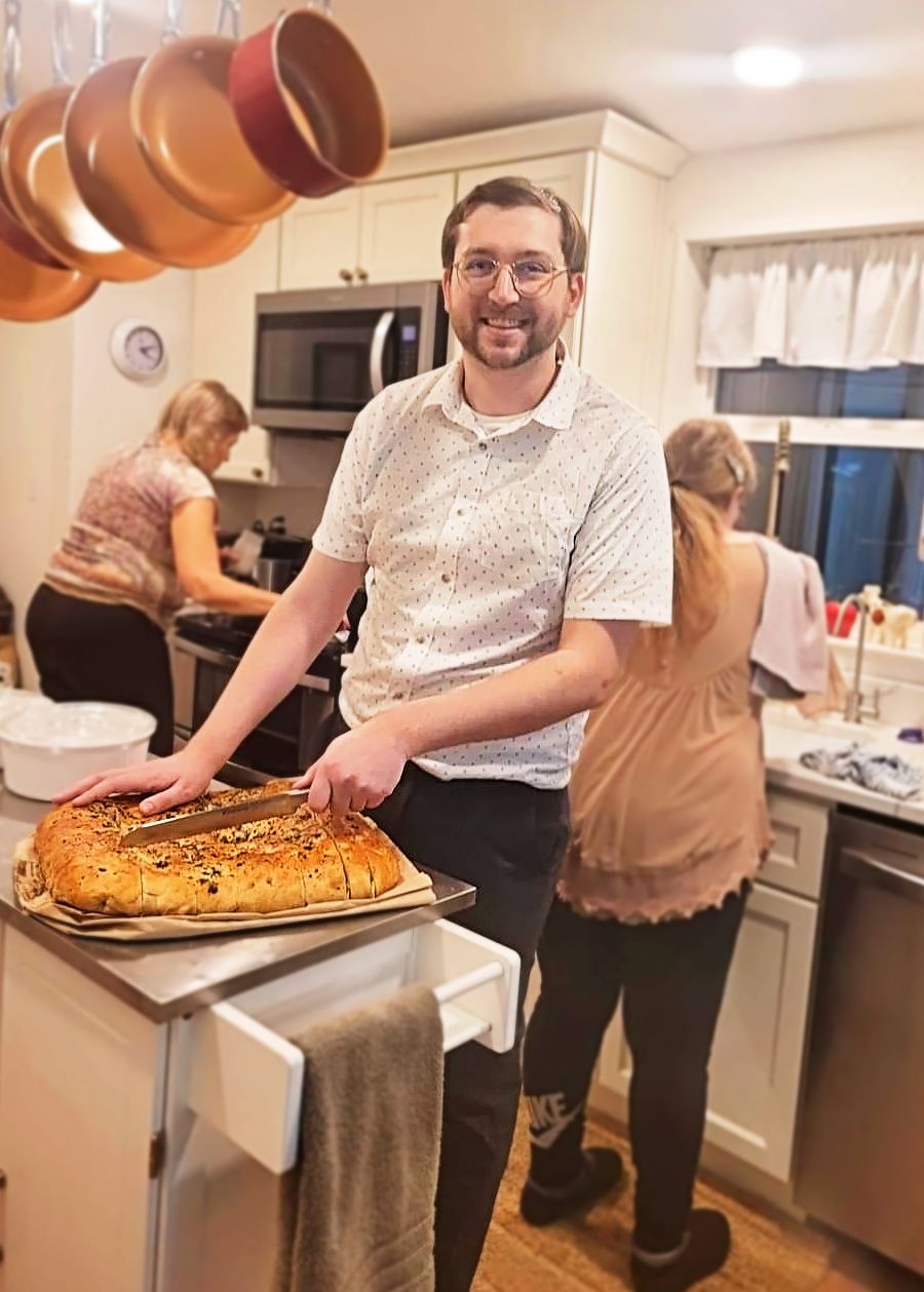 Josh cooking with family at home.
