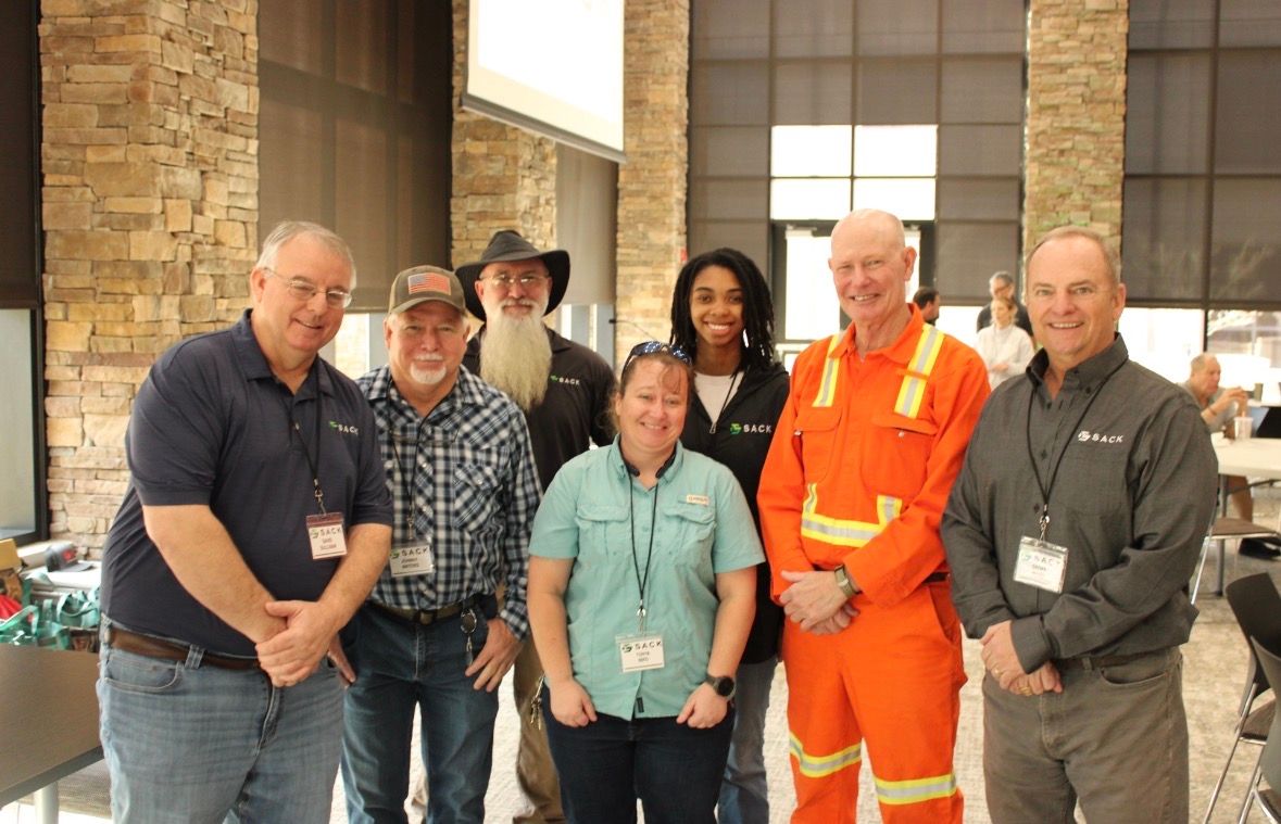 Sack Company team members gathered at a safety and training event, showcasing employee development, workplace safety, and company culture.