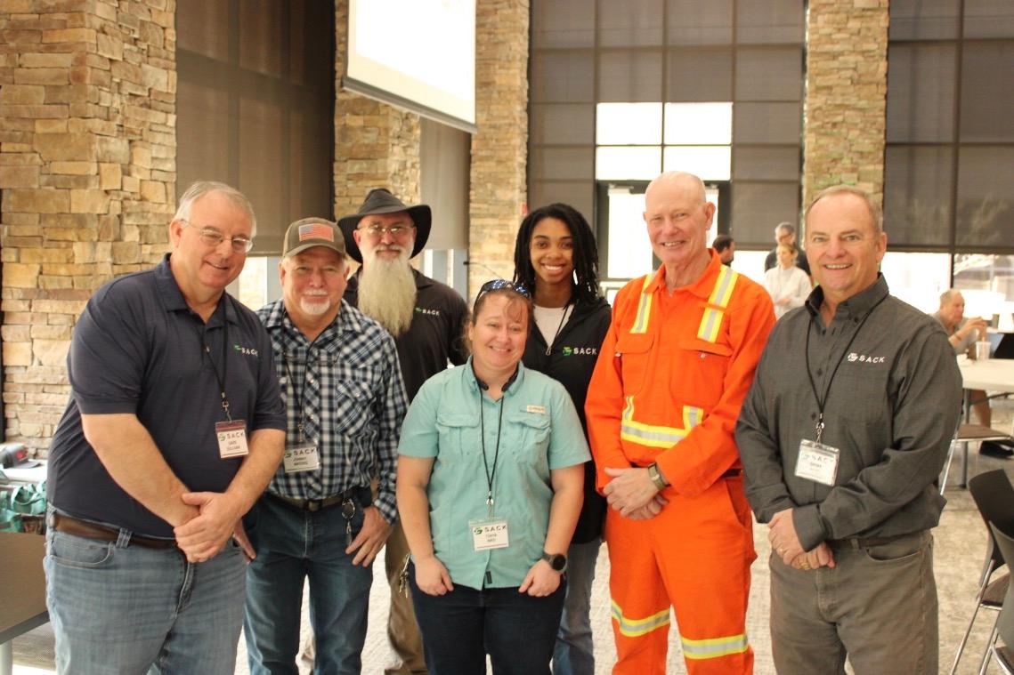 Sack Company team members gathered at a safety and training event, showcasing employee development, workplace safety, and company culture.