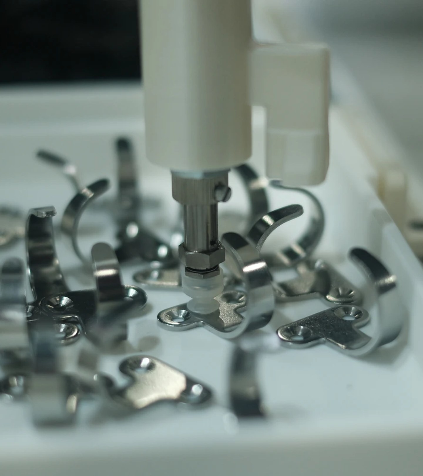 Bin picking small metal parts into a fixture