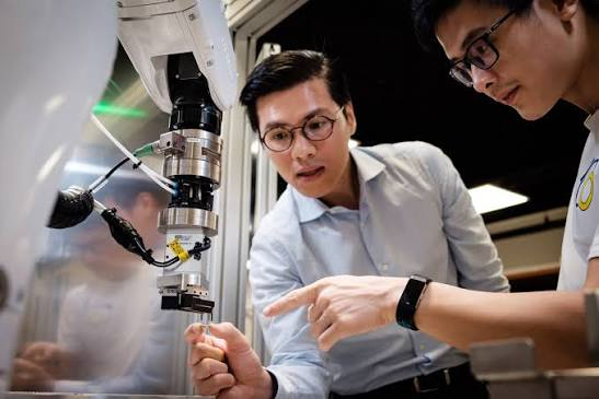 Eureka engineers testing a gripper in the lab