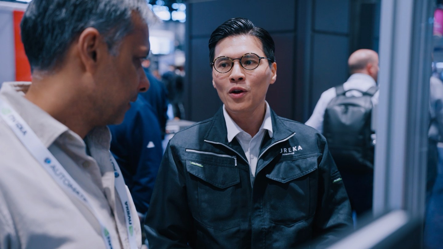 A Eureka engineer talking with a visitor