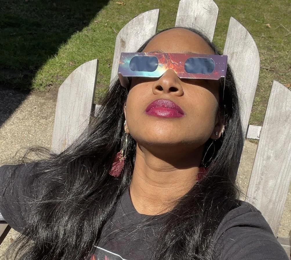 woman close up selfie wearing solar eclipse glasses sunlight — people viewing the eclipse with protective glasses