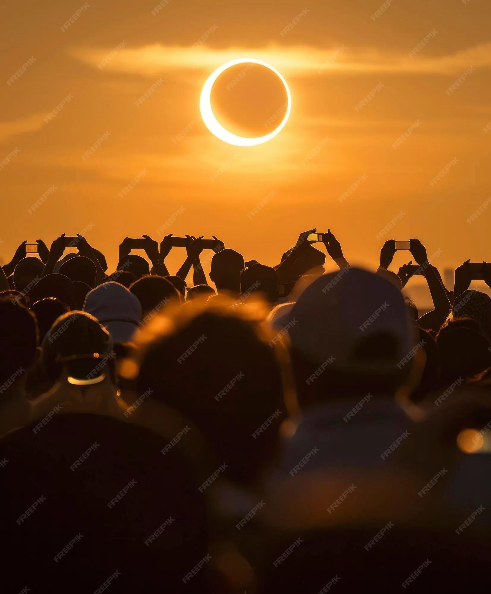 Premium Photo | A crowd of people watching the solar eclipse wearing ...