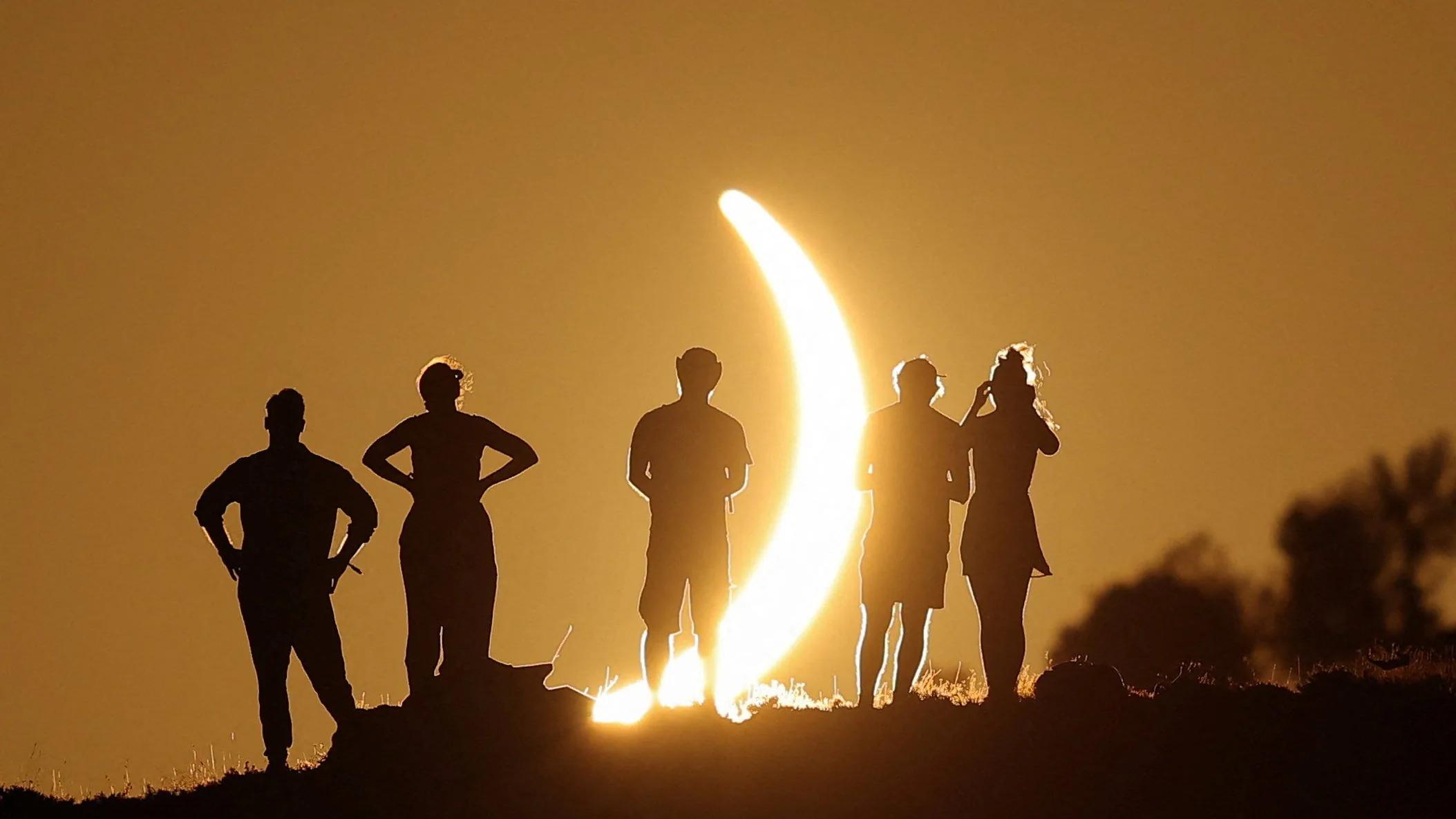 Rare solar eclipse draws crowds of people around the world. See photos