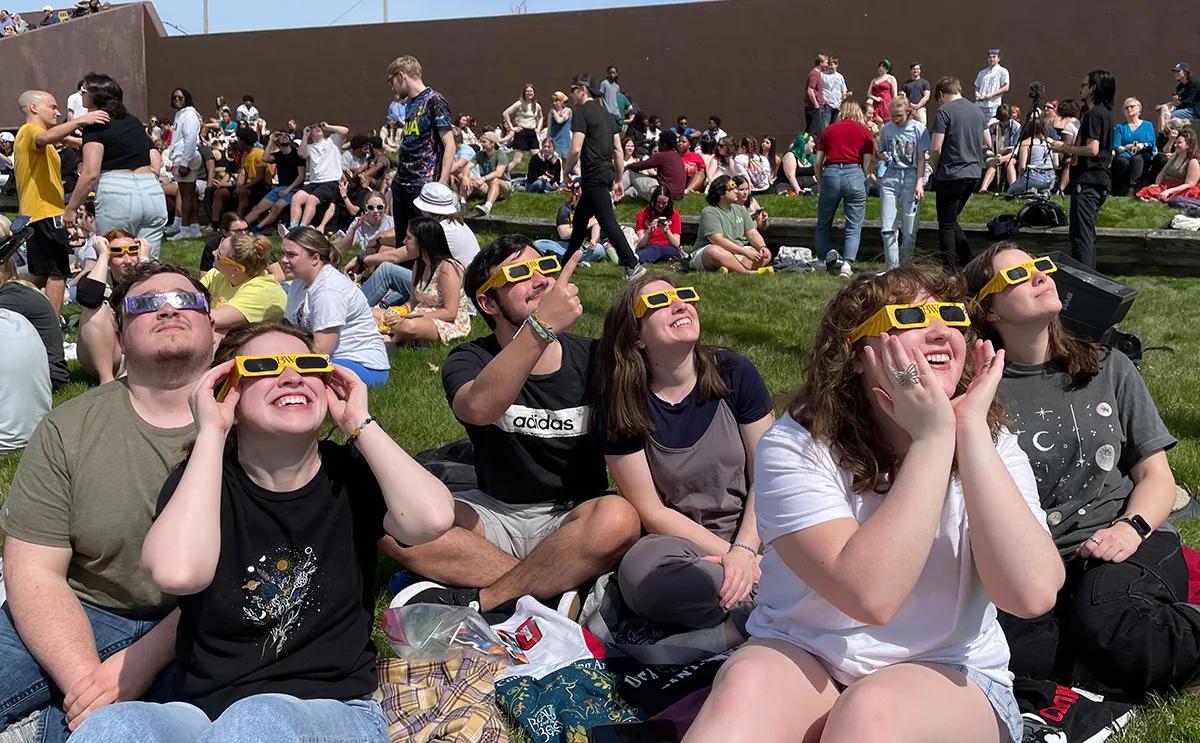BW crowd cheers rare sight of the moon stealing the sun's spotlight