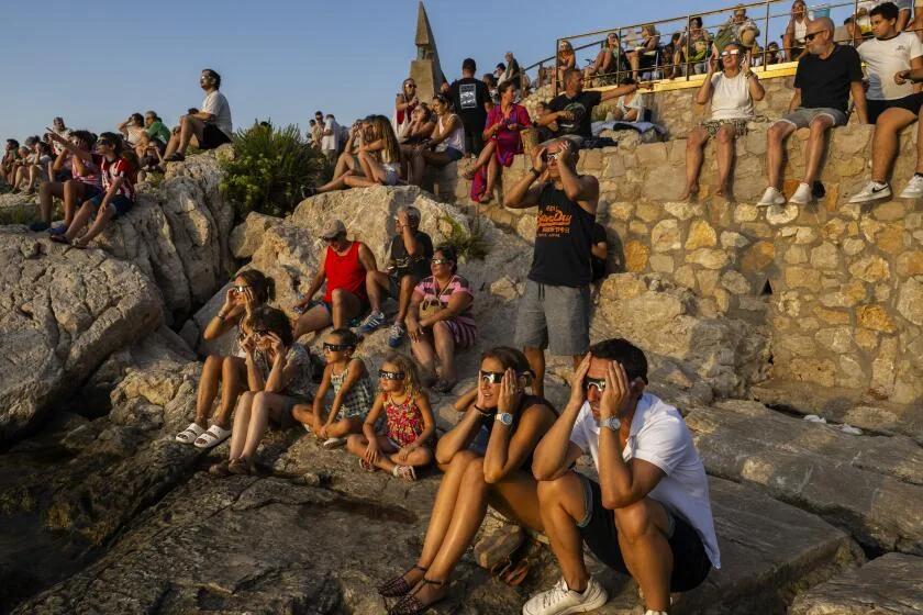 Millions crowd Spanish cities to see country's first total solar eclipse in over a century - AOL