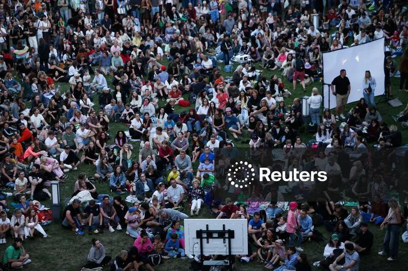 Licensable picture: People gather to watch on the screens partial solar eclipse, at the Copernicus Science Centre in Warsaw | Reuters Connect