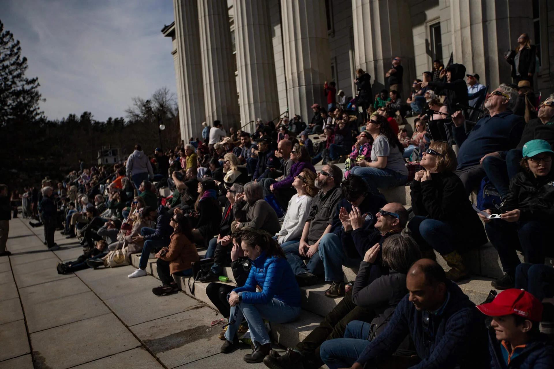Photos: People watch in wonder as eclipse blots out the sun ...
