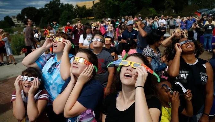 Photos: Solar eclipse sneaks through clouds in Des Moines