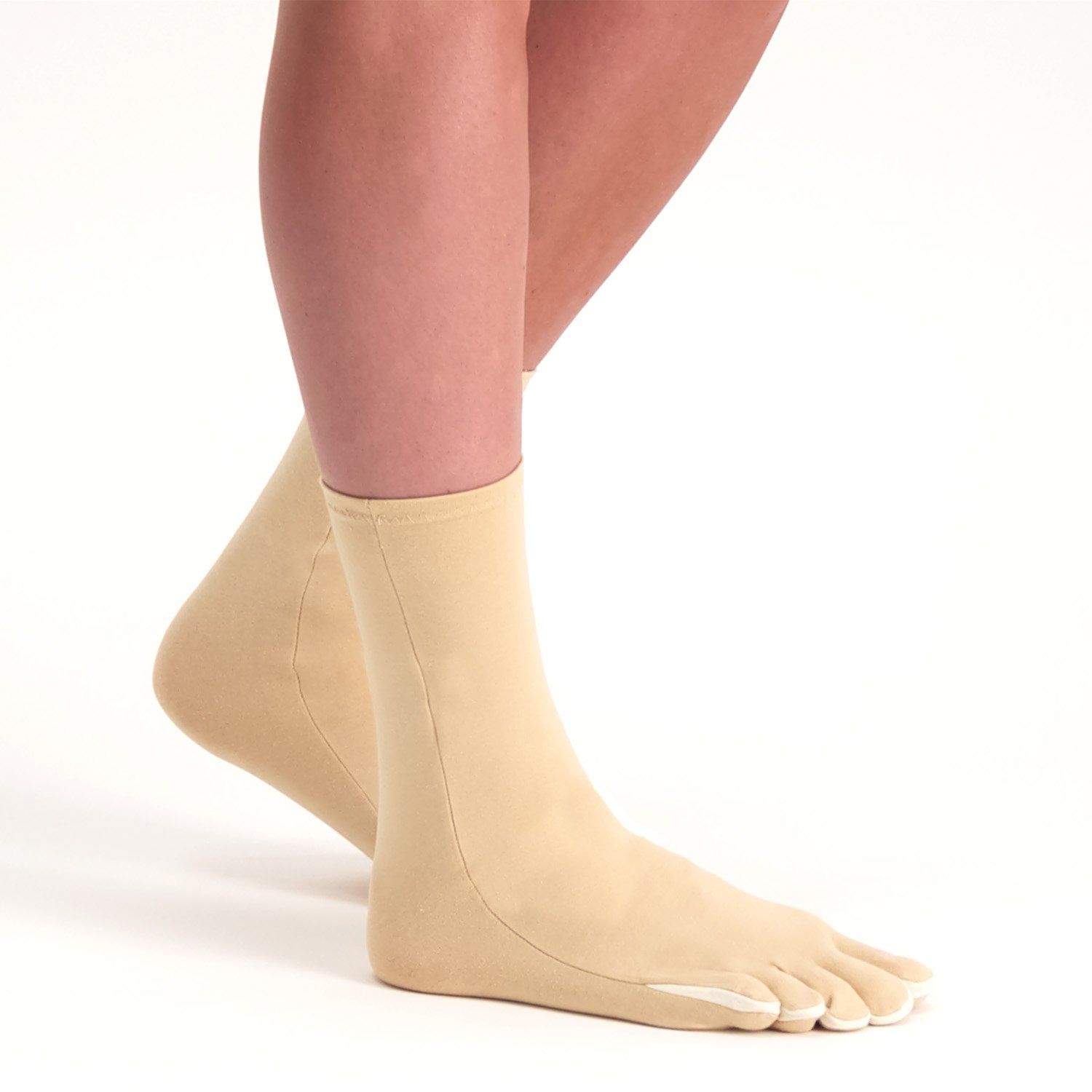 Side view of the Dunimed rheumatoid arthritis osteoarthritis socks in beige worn while standing