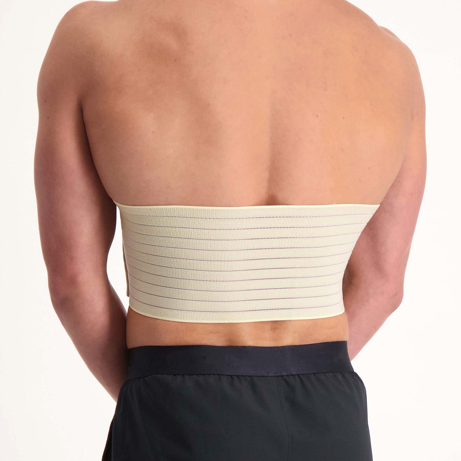 Back view of the Dunimed Rib Support worn by male model