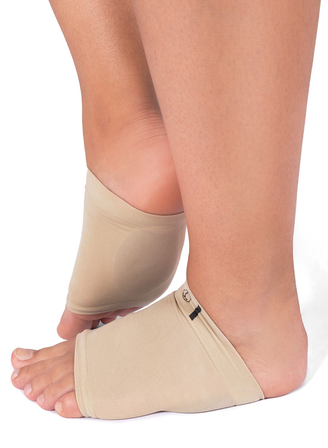 Left side view of model wearing the Solelution Metatarsal Cushion