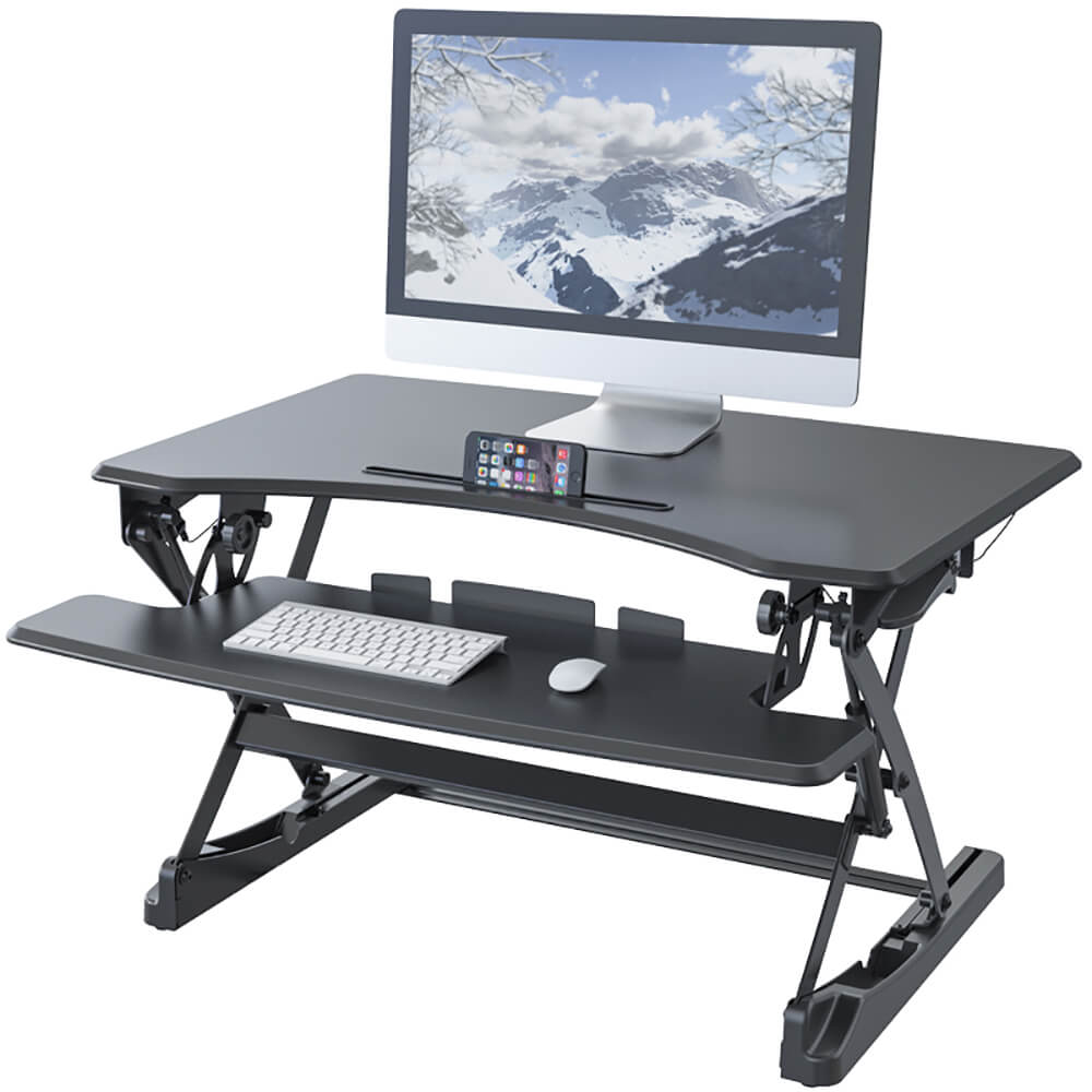 in height adjustable desk with computer on it zoomed in
