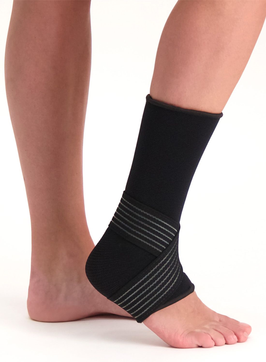 Dunimed Premium Ankle Support Black worn by model around the right ankle