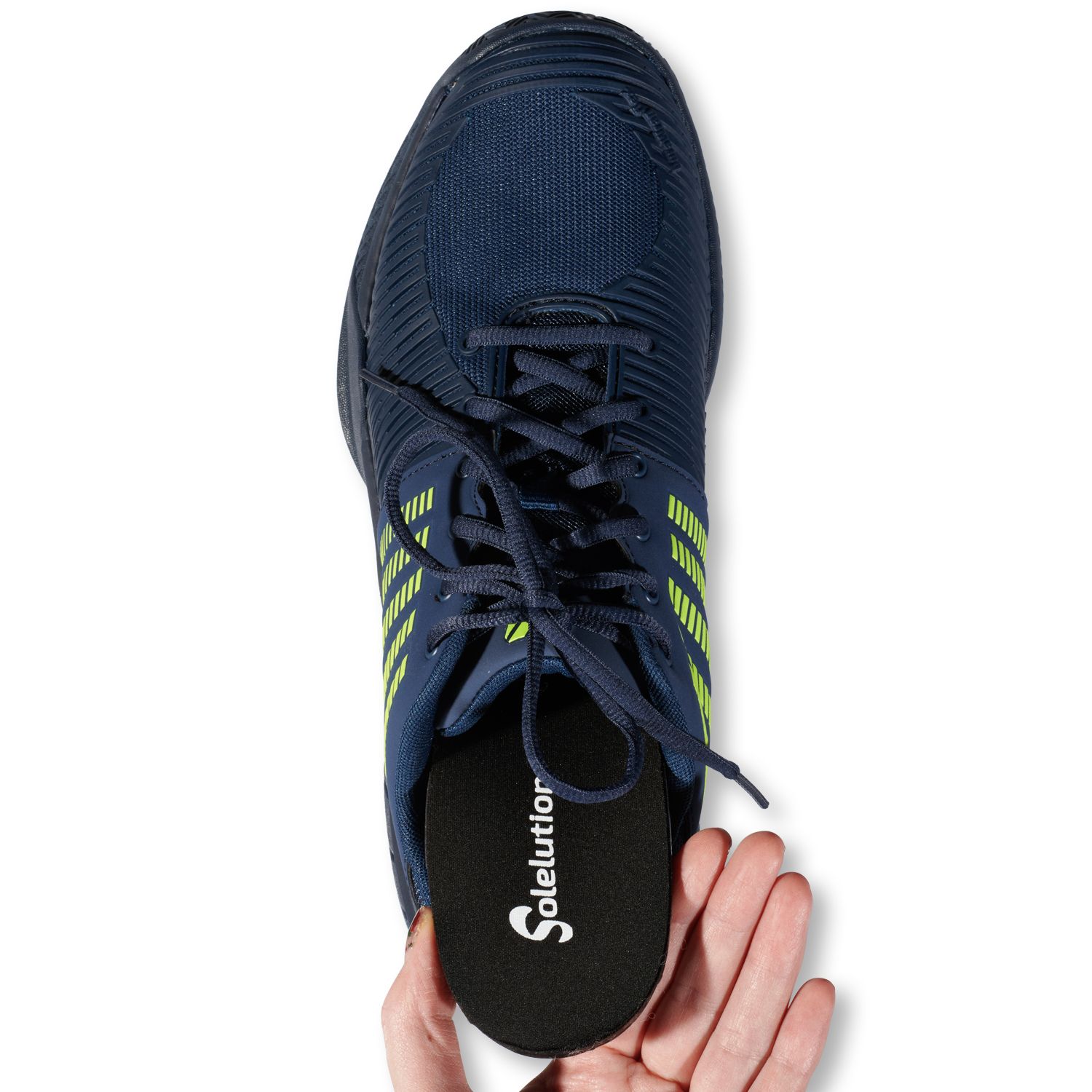 Solelution Comfort Insoles being put in sports shoe