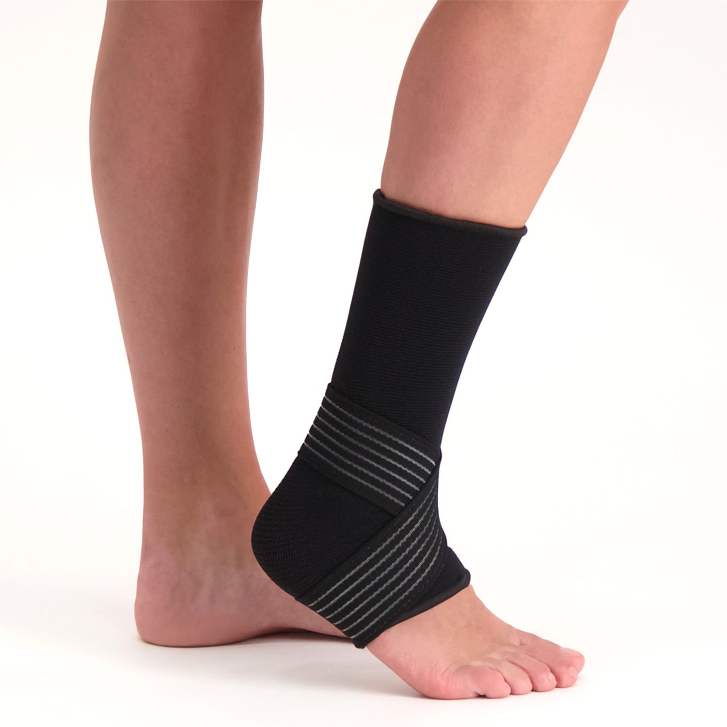 Dunimed premium ankle support in the colour black worn on right root by person