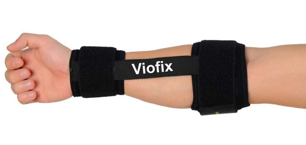 Medial side of an extended arm while wearing the Viofix bowling tennis elbow support