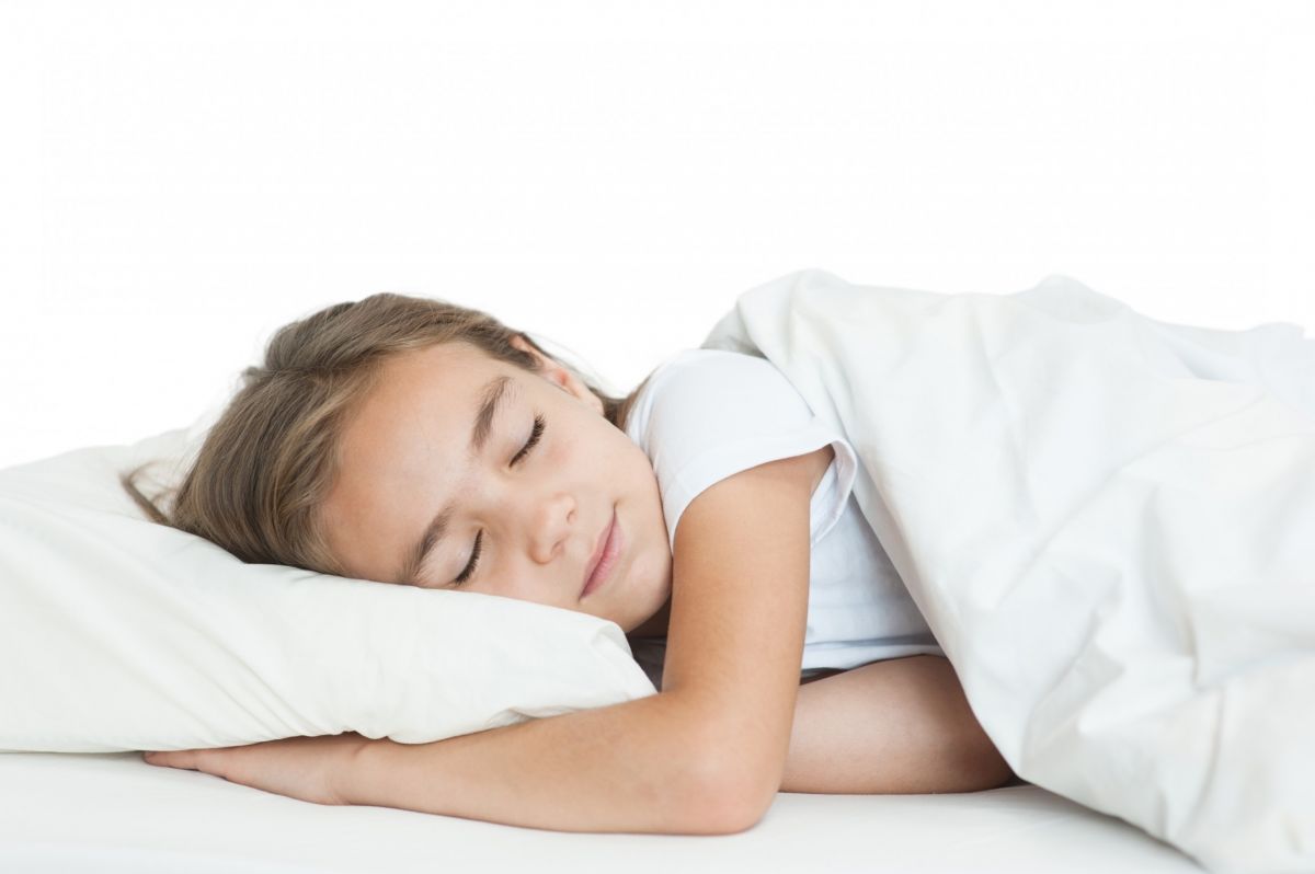 dunimed children's pillow used by a child sleeping on it on her side