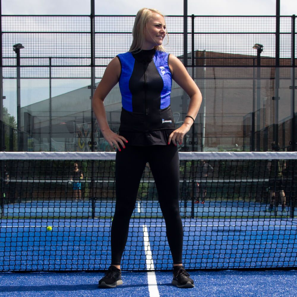 Female model wearing the Gladiator Cool - Bodycool Cooling Vest while playing tennis