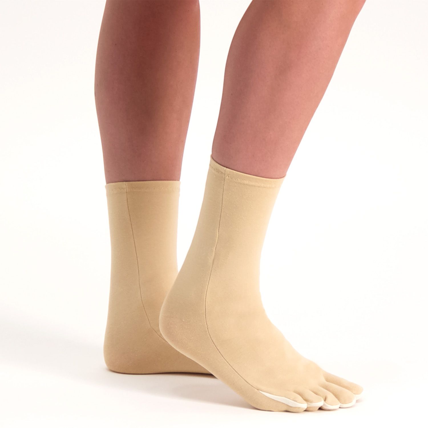 Side view of model wearing the Raynaud's Disease / Osteoarthritis Socks in Beige