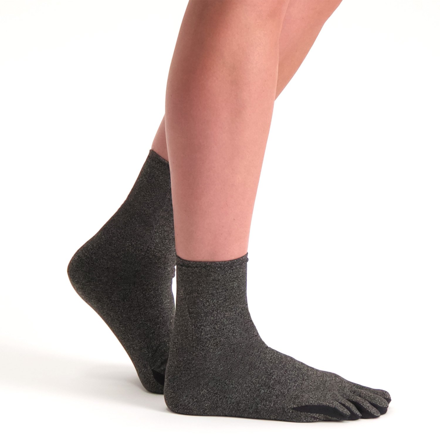 Model walking while wearing the Raynaud's Disease / Osteoarthritis Socks in Grey