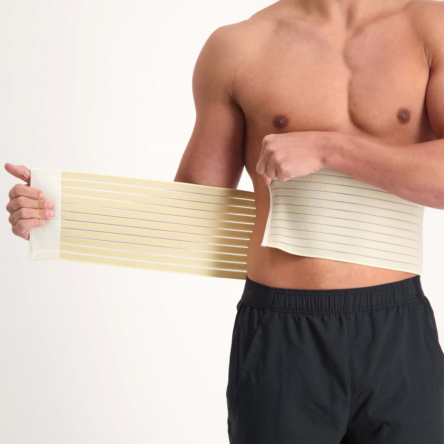 Male model putting the Dunimed Rib Support on around his torso