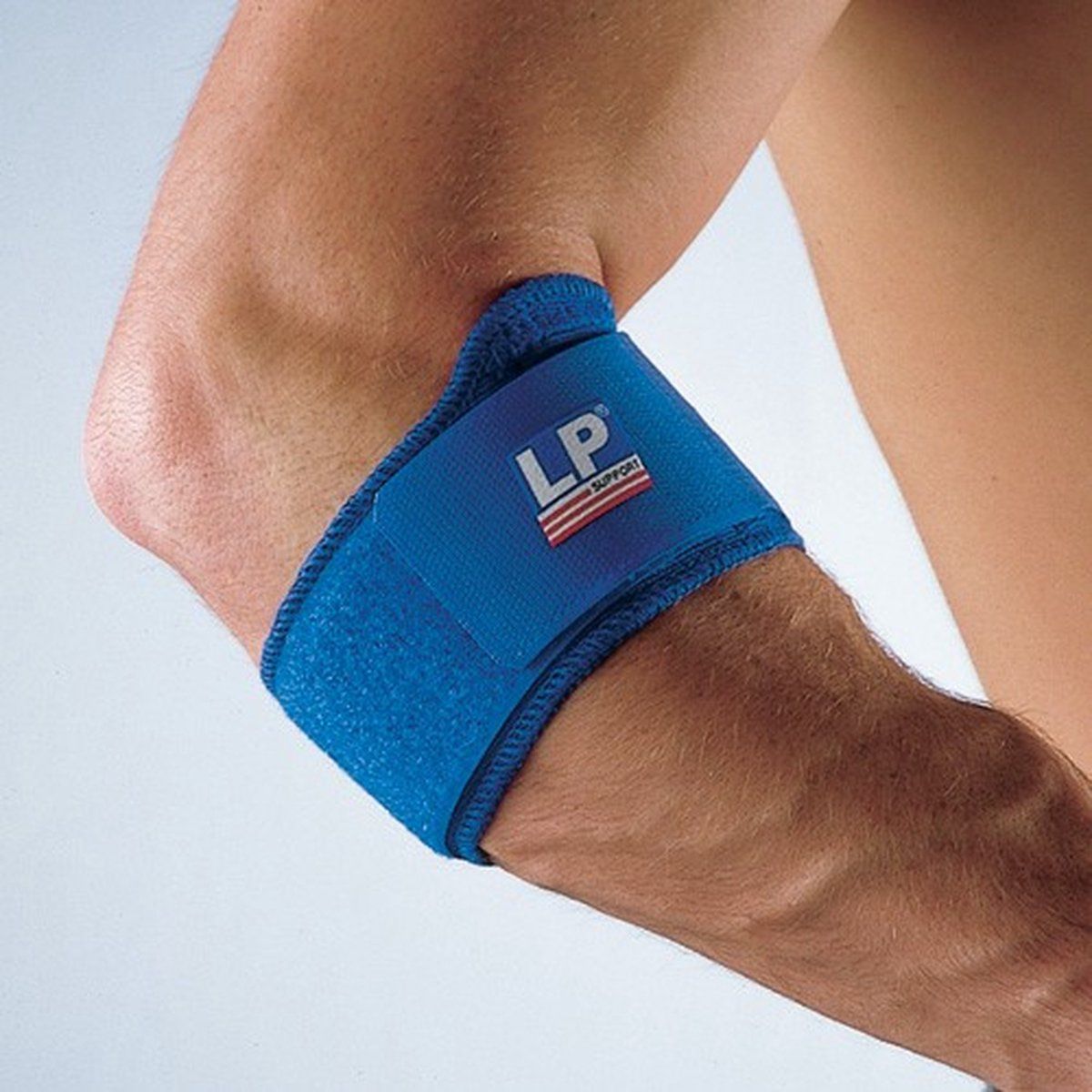 LP support tennis elbow support worn by model