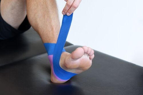 step by step method taping sprained ankle