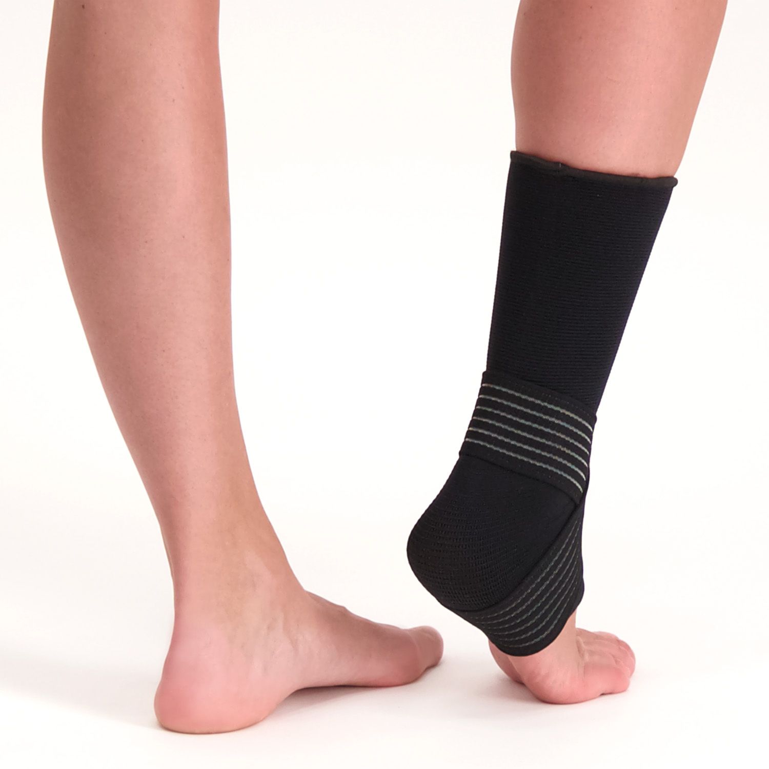 Back side view of model wearing the Dunimed Premium Ankle Support Black