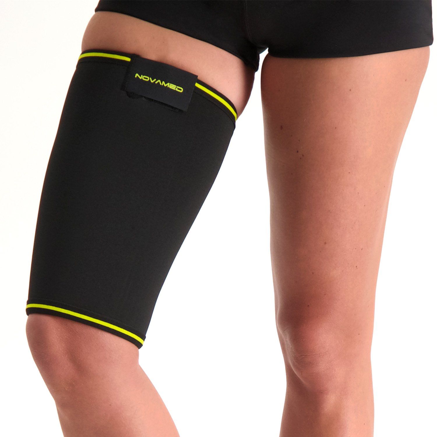 Novamed Thigh Support worn by model around the right thigh with the leg pulled forward