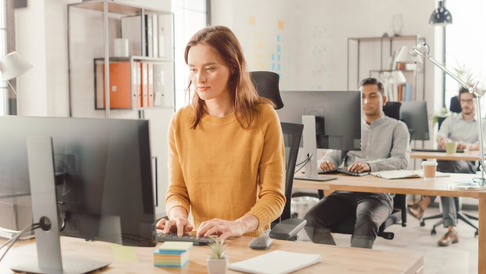 people working by ergonomic rules at office