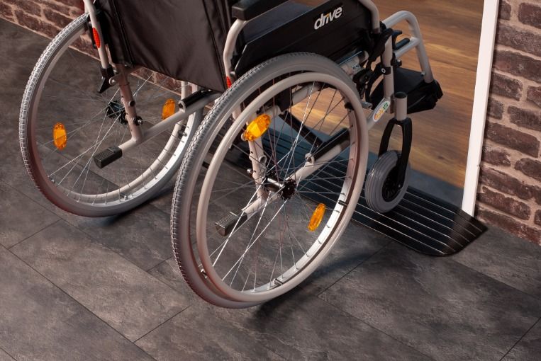 A wheelchair using the budget threshold ramp