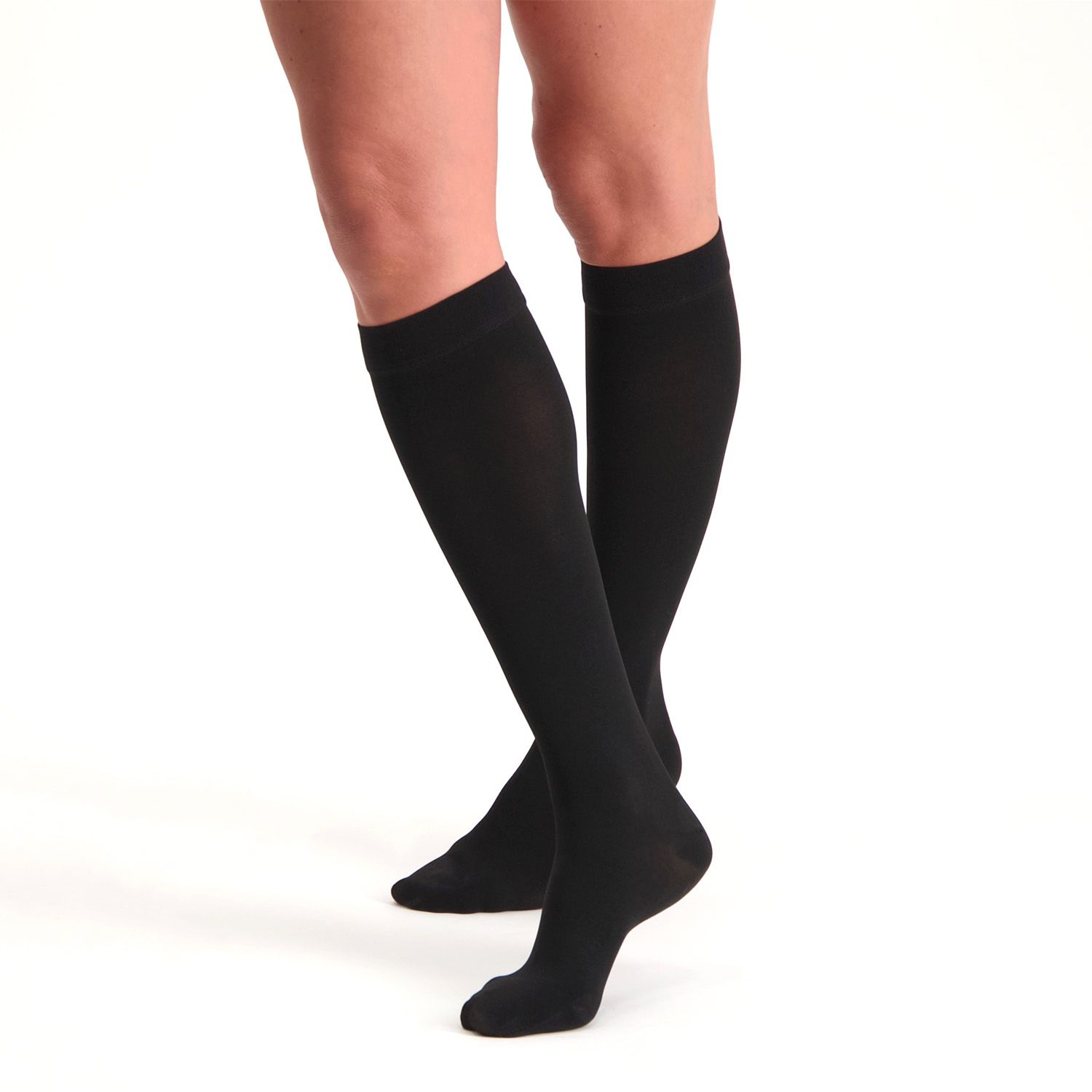 dunimed premium comfort compression stockings short closed toe in black worn by model on both legs with the right leg crossed over the left leg