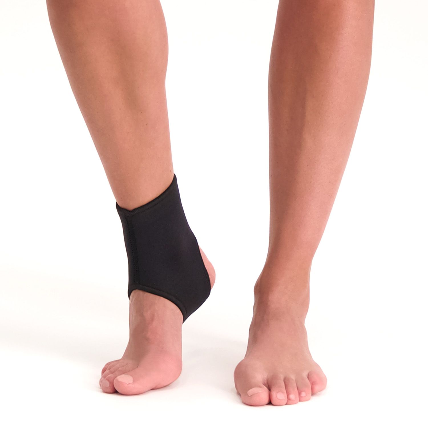 Model wearing the Dunimed Ankle Support around the right ankle while walking barefoot