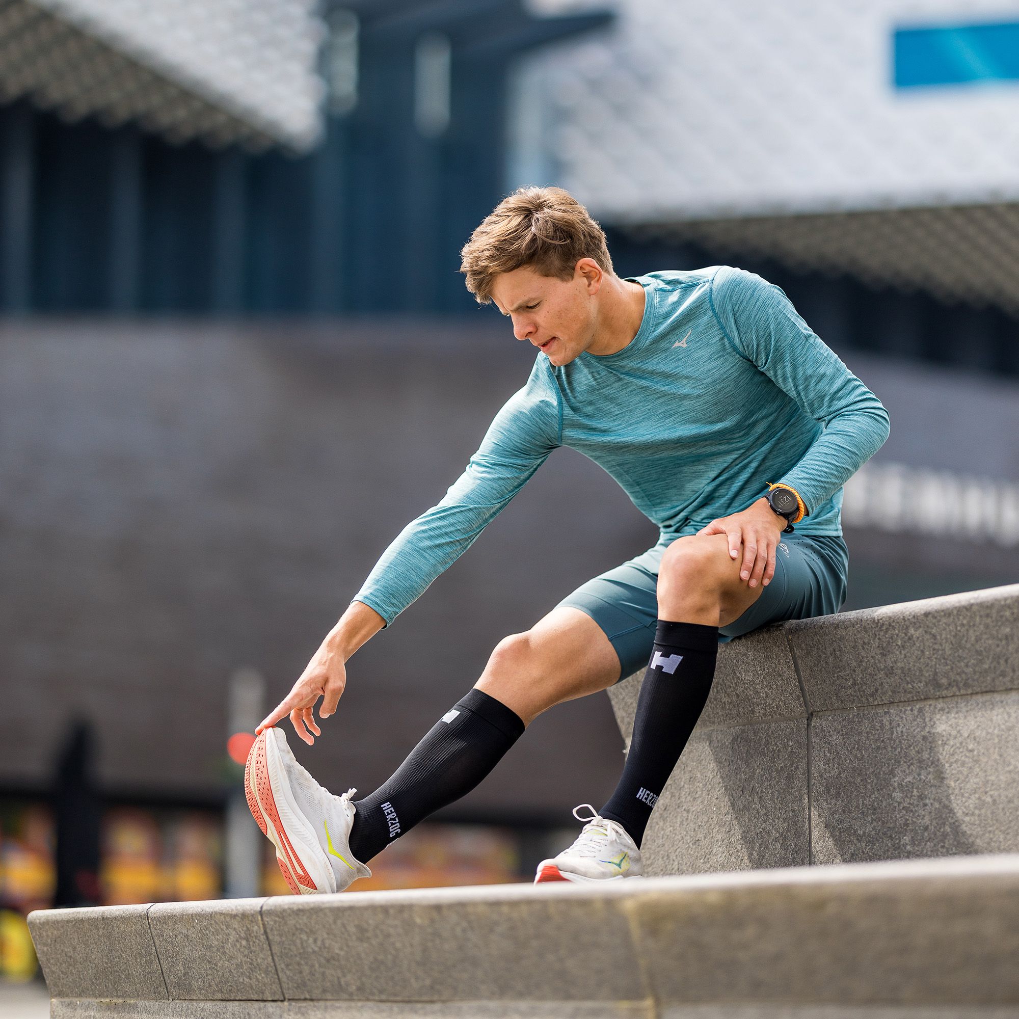 Herzog Sport Compression Stockings in the colour black worn by male runner