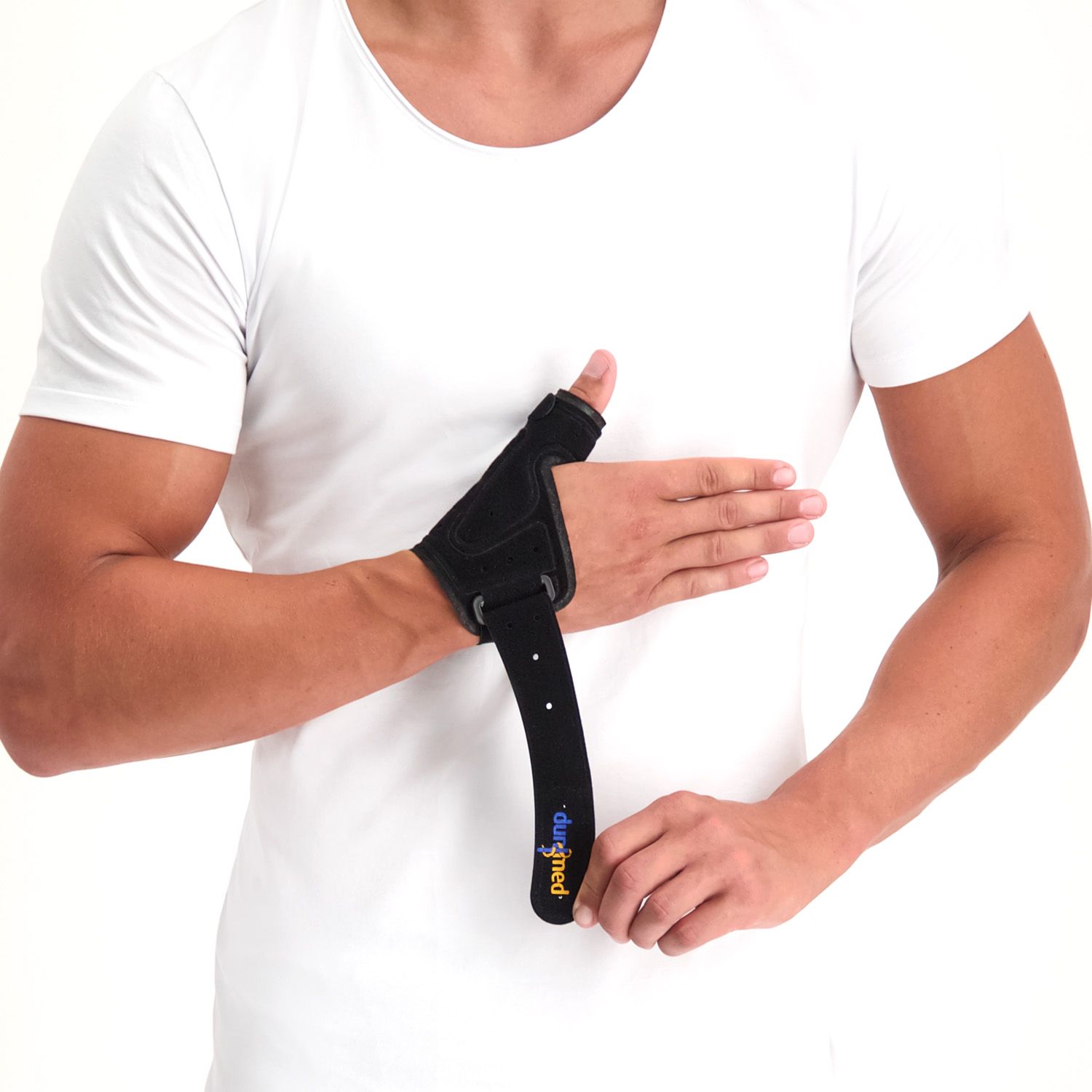 Dunimed Manu Thumb Support being put on by male model showing the Velcro strap