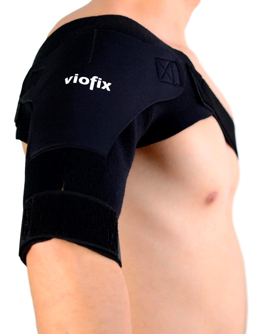 Side view of model wearing the Viofix Lightweight Shoulder Support around right shoulder